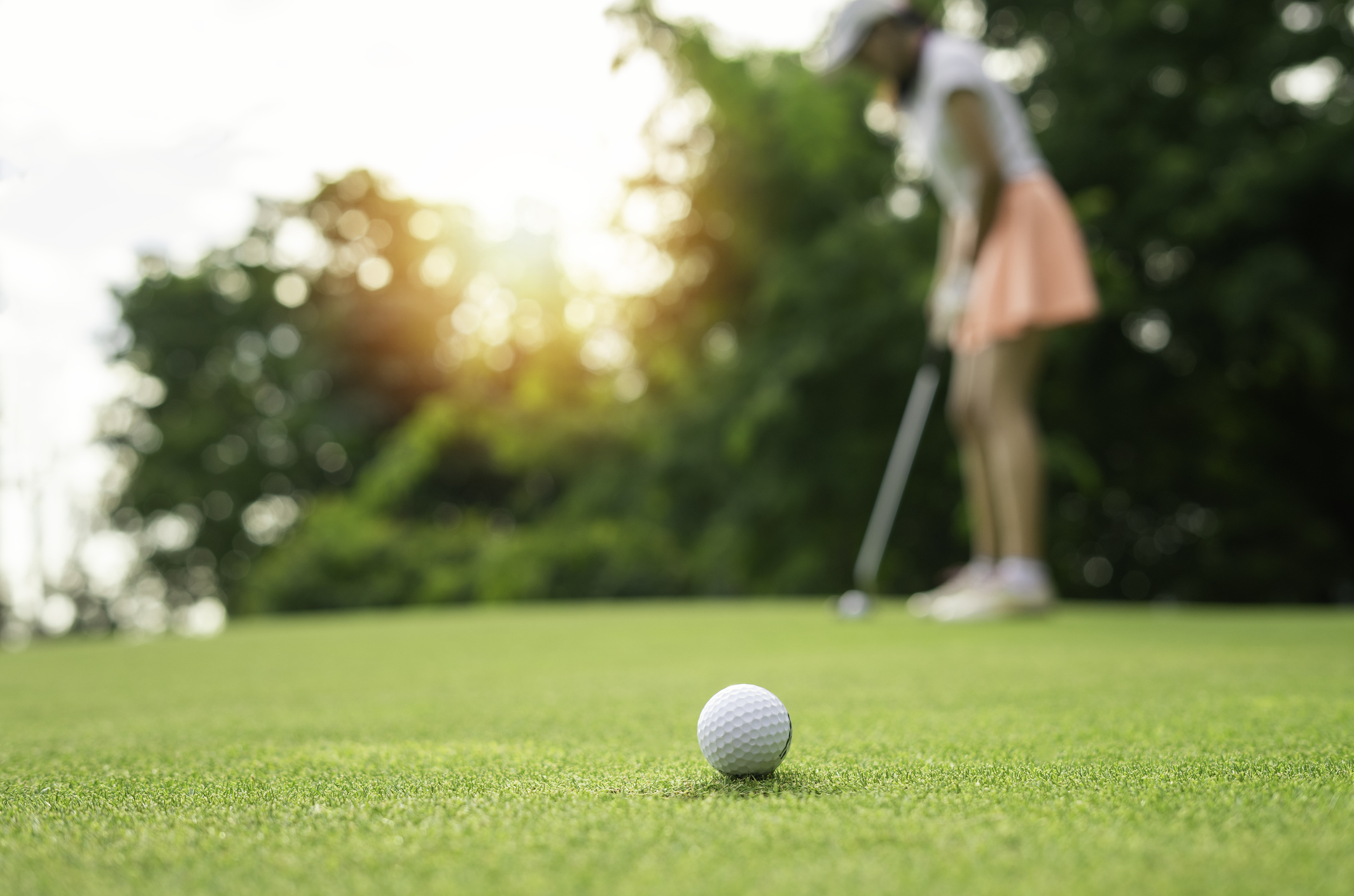woman at golf tee box, golf insurance protection